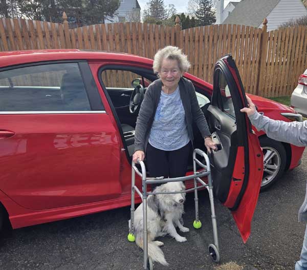 Mom and Ozzy testing new red Chevy Cruze after replacing broken car.